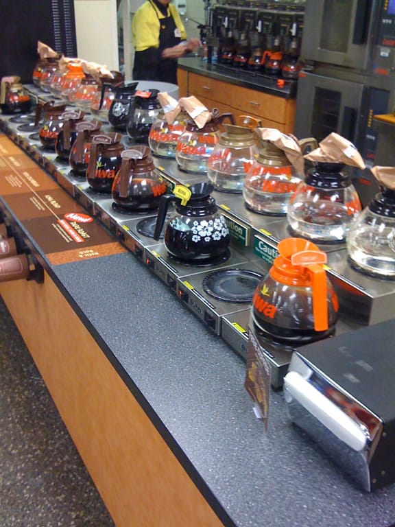 Interior of a Wawa showing various coffee pots.